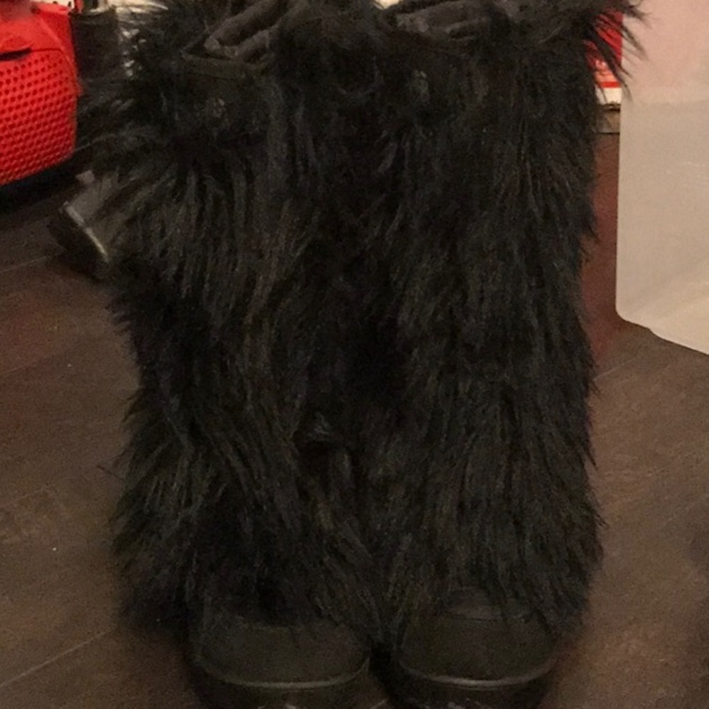 Tall black furry cold weather boots